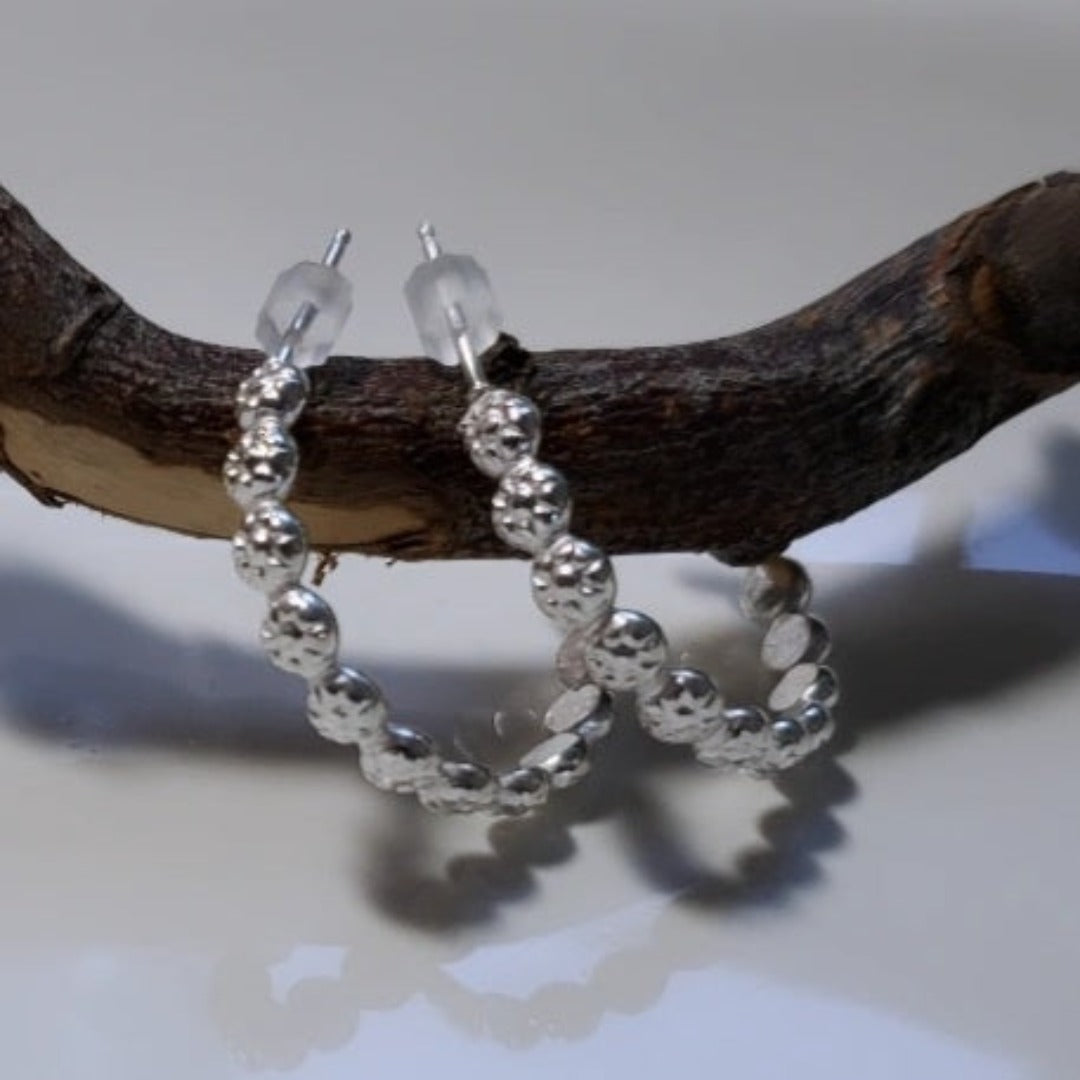 Introducing Sterling Silver Berry Dainty or Dynamic Hoops, the perfect addition to your everyday wardrobe. These versatile hoops feature a captivating berry-flower design, adding a touch of nature-inspired beauty to your look. Wear them alone or mix and match with other earrings to create a dynamic and personalized style.