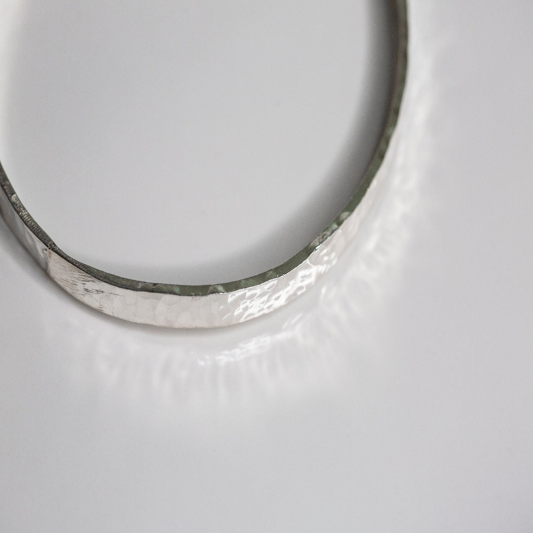 My Sterling Silver Rectangle Dimpled Bangle is handmade with a heavier gauge sterling silver and hammered for a dimpled look that catches the light beautifully. Wrap your wrist with style—why wear one when you can wear all three?