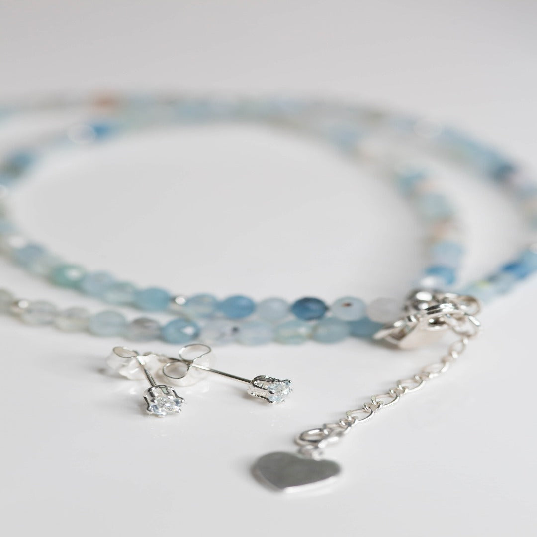 Aquamarine Gemstone Layering Necklace with a Heart Charm, featuring 3.7mm micro-faceted aquamarine gemstones. The soothing blue hue and subtle shimmer of the gemstones, paired with a delicate heart charm, make this necklace perfect for minimalistic and elegant looks. Ideal for both formal and casual outfits.