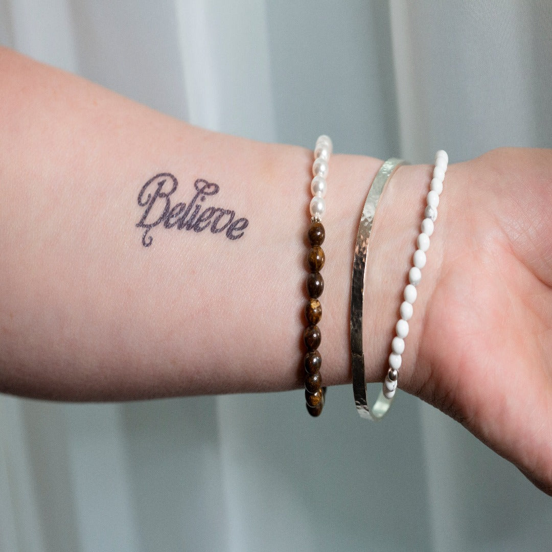 My Sterling Silver Rectangle Dimpled Bangle is handmade with a heavier gauge sterling silver and hammered for a dimpled look that catches the light beautifully. Wrap your wrist with style—why wear one when you can wear all three?