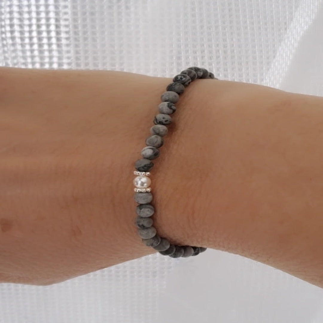 Introducing my Grounding 4mm Picture Jasper Gemstone Bracelet – a blend of timeless elegance and inner calm. Crafted with precision and passion, it adorns your wrist with luxury and serenity. Paired with Sterling Silver daisy spacers for sophistication. Wear it solo for refined elegance or mix and match for a unique stack. Elevate your style with Plein De Vie Jewelry.