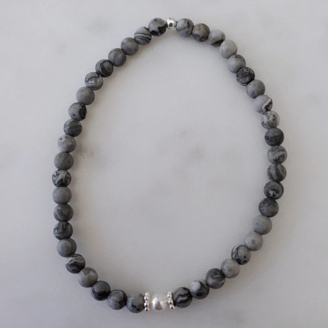 Introducing my Grounding 4mm Picture Jasper Gemstone Bracelet – a blend of timeless elegance and inner calm. Crafted with precision and passion, it adorns your wrist with luxury and serenity. Paired with Sterling Silver daisy spacers for sophistication. Wear it solo for refined elegance or mix and match for a unique stack. Elevate your style with Plein De Vie Jewelry.