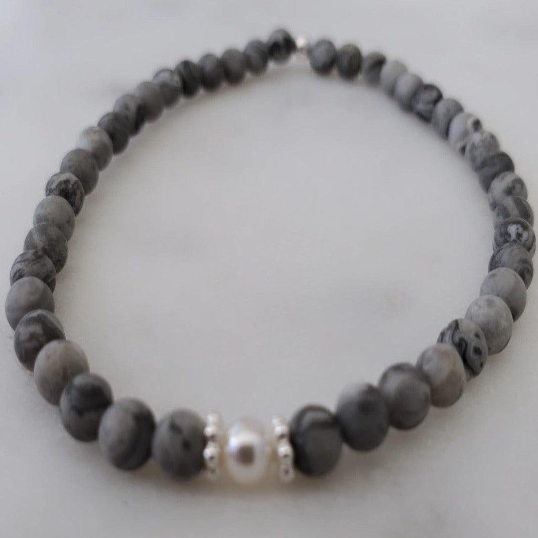 Introducing my Grounding 4mm Picture Jasper Gemstone Bracelet – a blend of timeless elegance and inner calm. Crafted with precision and passion, it adorns your wrist with luxury and serenity. Paired with Sterling Silver daisy spacers for sophistication. Wear it solo for refined elegance or mix and match for a unique stack. Elevate your style with Plein De Vie Jewelry.