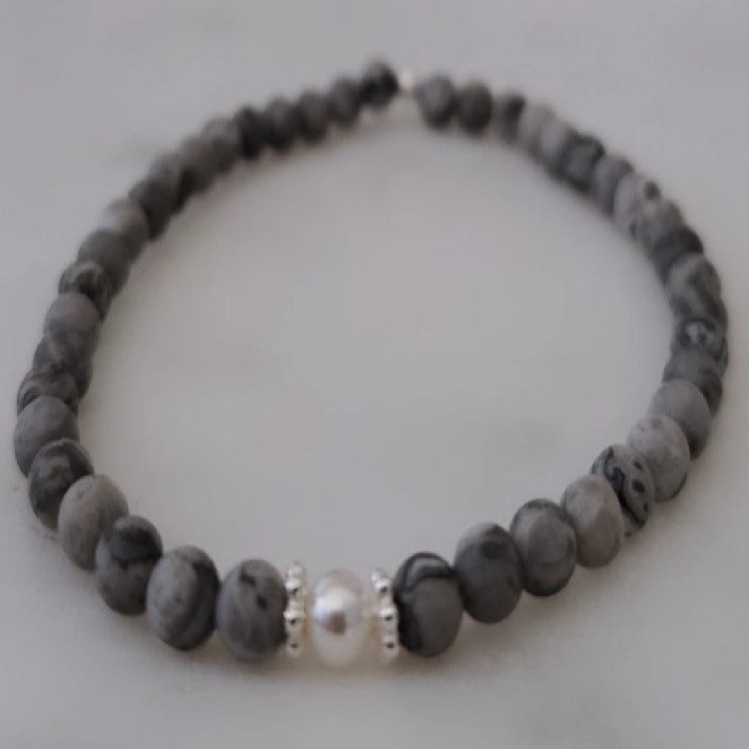Introducing my Grounding 4mm Picture Jasper Gemstone Bracelet – a blend of timeless elegance and inner calm. Crafted with precision and passion, it adorns your wrist with luxury and serenity. Paired with Sterling Silver daisy spacers for sophistication. Wear it solo for refined elegance or mix and match for a unique stack. Elevate your style with Plein De Vie Jewelry.