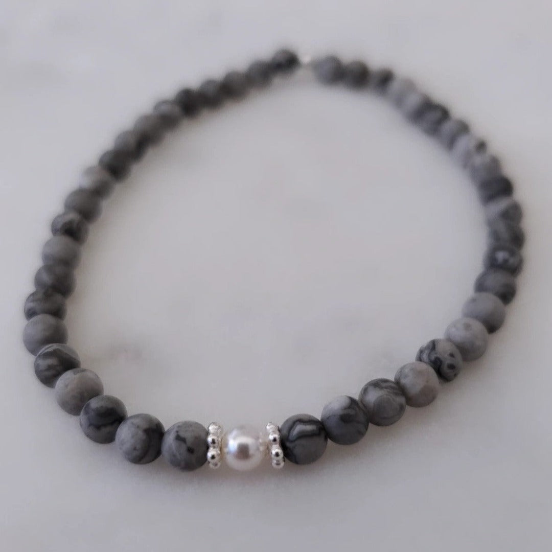 Introducing my Grounding 4mm Picture Jasper Gemstone Bracelet – a blend of timeless elegance and inner calm. Crafted with precision and passion, it adorns your wrist with luxury and serenity. Paired with Sterling Silver daisy spacers for sophistication. Wear it solo for refined elegance or mix and match for a unique stack. Elevate your style with Plein De Vie Jewelry.