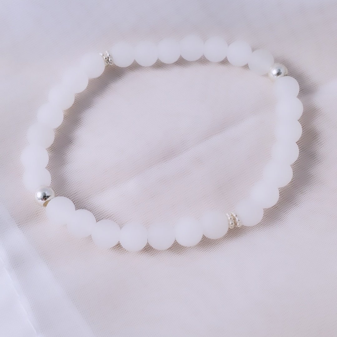 Icy Whispers: Sterling Silver Snowflake & White Jade Bracelet