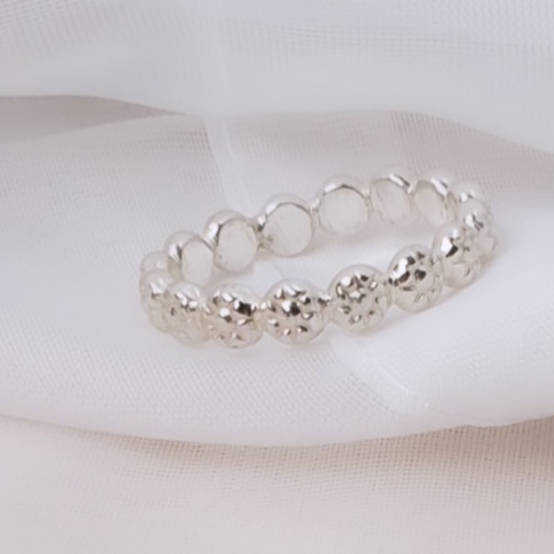 Sterling Silver Berry Dainty or Dynamic Rings featuring interlocking berry-flower designs. These versatile rings can be stacked together for a bold look or worn individually for a minimalist style. Perfect for everyday wear, they offer endless possibilities for creative expression and fashion-forward statements.
