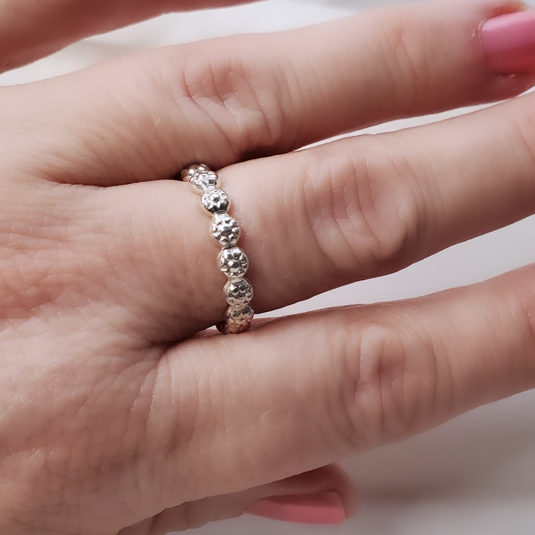 Sterling Silver Berry Dainty or Dynamic Rings featuring interlocking berry-flower designs. These versatile rings can be stacked together for a bold look or worn individually for a minimalist style. Perfect for everyday wear, they offer endless possibilities for creative expression and fashion-forward statements.