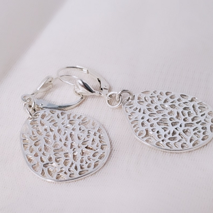 Introducing my Sterling Silver Leverback Filigree Fantasy Earrings: a must-have for everyday elegance.  Featuring large oval filigree pendants suspended from sterling silver heart leverbacks, these earrings evoke the vintage charm of antique lace. Crafted from durable sterling silver, they offer a radiant and versatile accessory for any occasion.