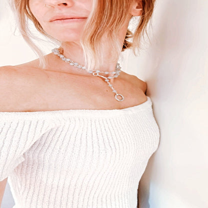 Picture of the handmade Sterling Silver Aquamarine Necklace "BELIEVE." This 31" necklace features genuine aquamarine round gemstones linked with 20g sterling silver, secured with a lobster clasp. The washer-style pendant stamped with "BELIEVE" adds a meaningful touch, symbolizing authenticity, growth, love, inspiration, education, integrity, and joy. Wear it as a regular necklace or transform it into a lariat style to accentuate your style and remind yourself of these powerful principles.