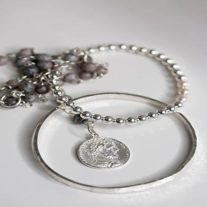 My Sterling Silver Rectangle Dimpled Bangle is handmade with a heavier gauge sterling silver and hammered for a dimpled look that catches the light beautifully. Wrap your wrist with style—why wear one when you can wear all three?
