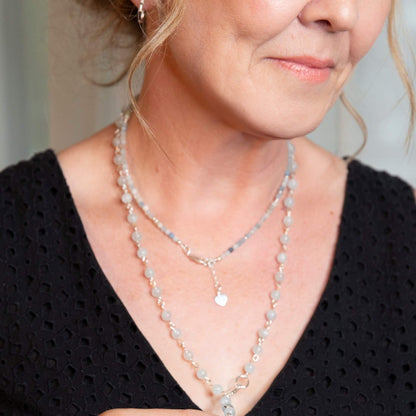 Aquamarine Gemstone Layering Necklace with a Heart Charm, featuring 3.7mm micro-faceted aquamarine gemstones. The soothing blue hue and subtle shimmer of the gemstones, paired with a delicate heart charm, make this necklace perfect for minimalistic and elegant looks. Ideal for both formal and casual outfits.