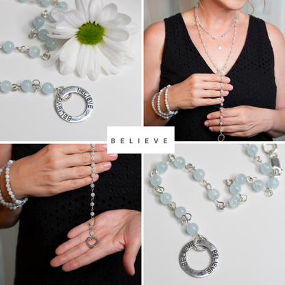 Picture of the handmade Sterling Silver Aquamarine Necklace "BELIEVE." This 31" necklace features genuine aquamarine round gemstones linked with 20g sterling silver, secured with a lobster clasp. The washer-style pendant stamped with "BELIEVE" adds a meaningful touch, symbolizing authenticity, growth, love, inspiration, education, integrity, and joy. Wear it as a regular necklace or transform it into a lariat style to accentuate your style and remind yourself of these powerful principles.