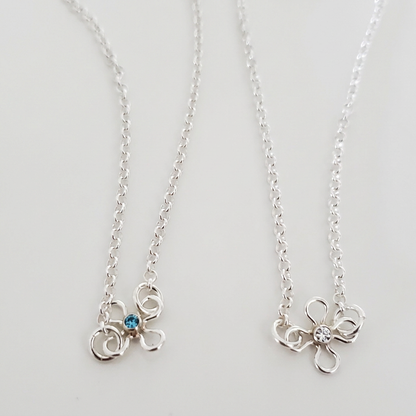 Brightened flower charm comparison
