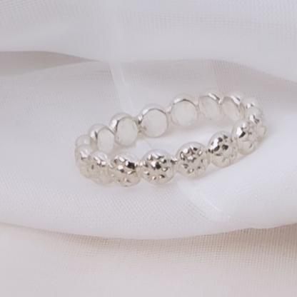 Sterling Silver Berry Dainty or Dynamic Rings featuring interlocking berry-flower designs. These versatile rings can be stacked together for a bold look or worn individually for a minimalist style. Perfect for everyday wear, they offer endless possibilities for creative expression and fashion-forward statements.