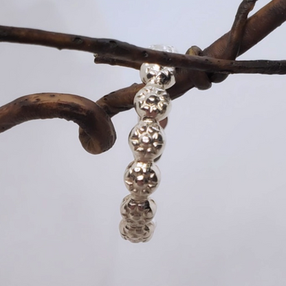 Sterling Silver Berry Dainty or Dynamic Rings featuring interlocking berry-flower designs. These versatile rings can be stacked together for a bold look or worn individually for a minimalist style. Perfect for everyday wear, they offer endless possibilities for creative expression and fashion-forward statements.